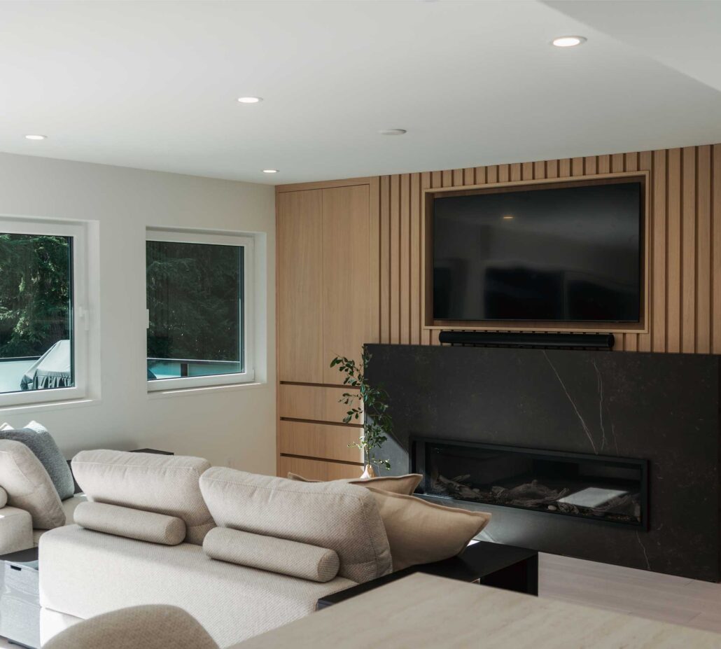 Bright living room with modern furniture and large windows.