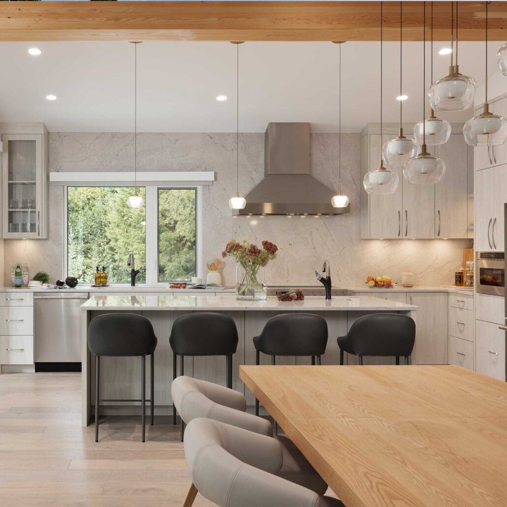 Kitchen view showing connection to dining and living areas with natural light.