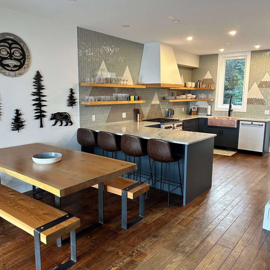 family room with large wooden kitchen table and kitchen in back