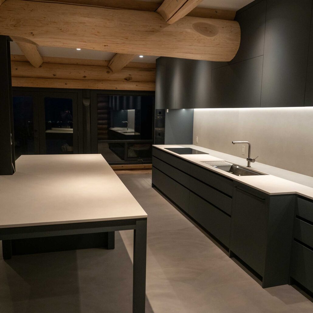 modern dark wood and black kitchen with large island
