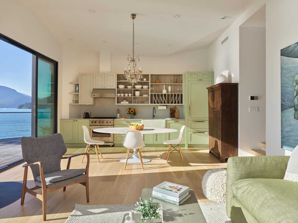 Open kitchen and living area with wood accents and bright natural lighting.